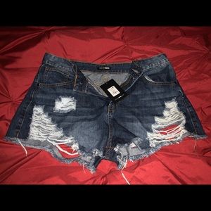 Reposhing distressed denim shorts